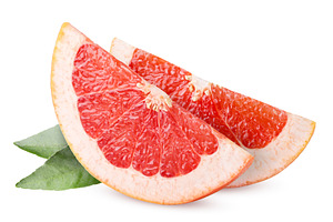 Grapefruit slices and leaves close, a Food & Drink Photo by innakreativ