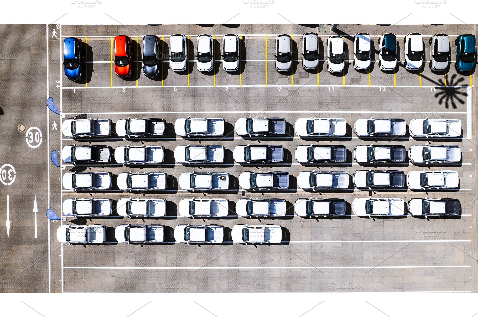 Aerial view of a parking lot at a, an Industrial Photo by HalfPoint