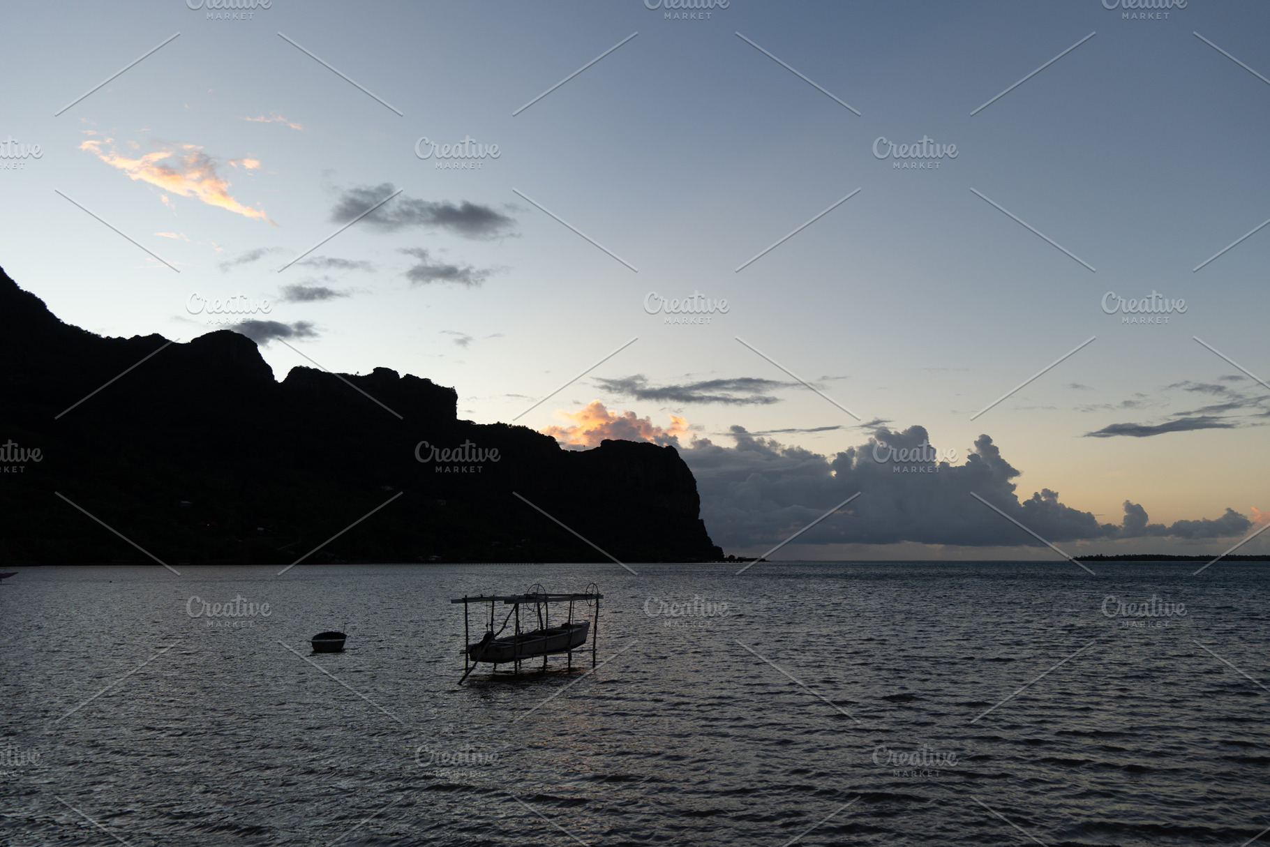 Sunset over the serene lagoon of Maupiti, French Polynesia, a Nature Photo by GoodGoods