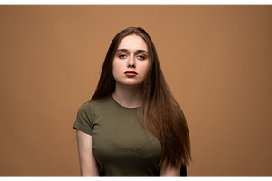 Young woman posing in a studio, a Person Photo by volodymyrshtun13795