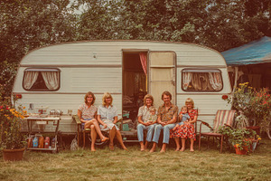 Family enjoying a sunny day outside, a Photo by Pavel_design