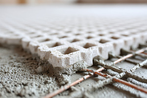 Concrete installation process seen up close in a construction project at a buil, an Industrial Photo by AlyaAnd
