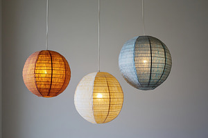Chinese paper lanterns on grey background, a Photo by AlyaAnd