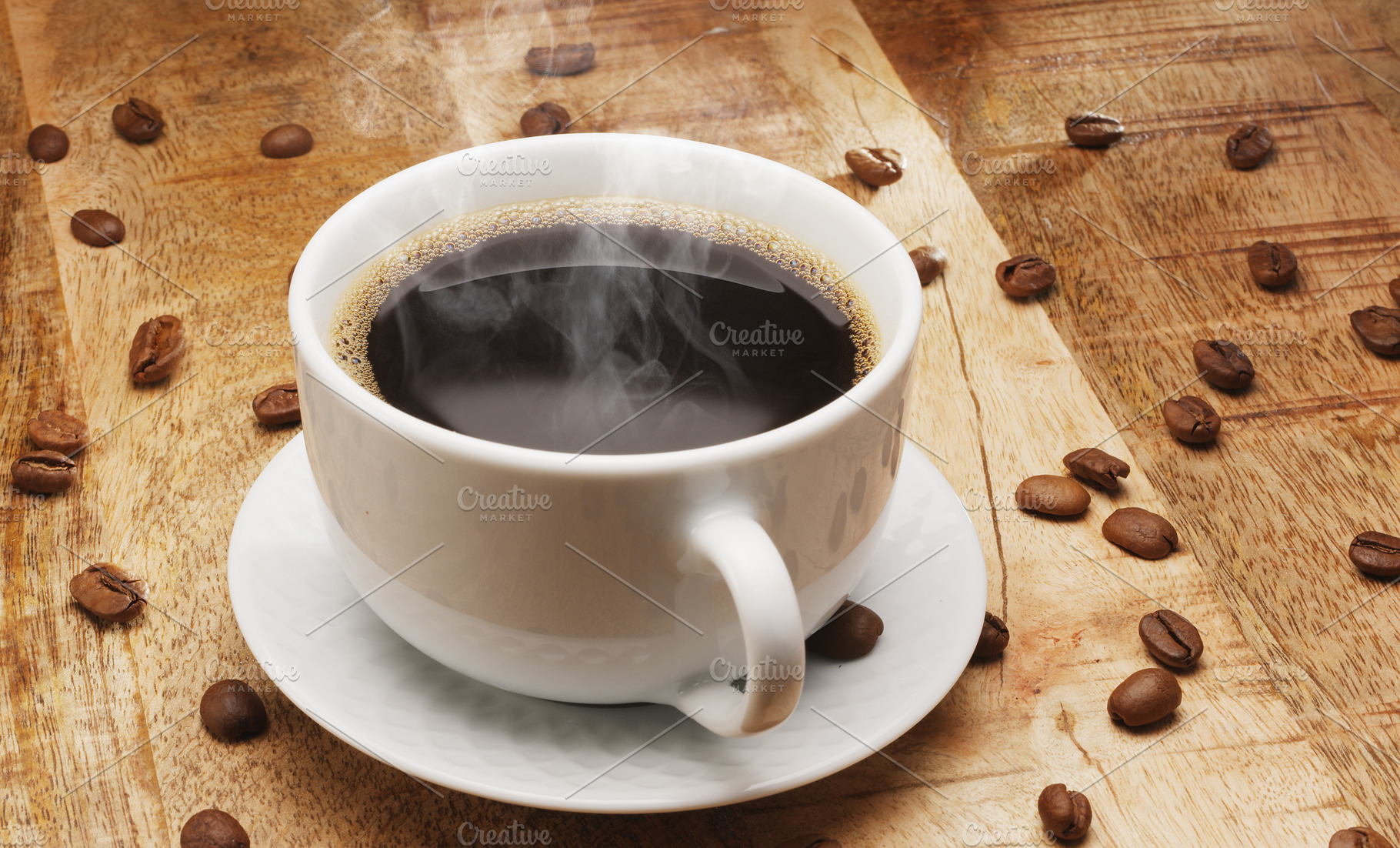 White cup of hot steaming coffee on a wooden table and roasted c, a Food & Drink Photo by Volff