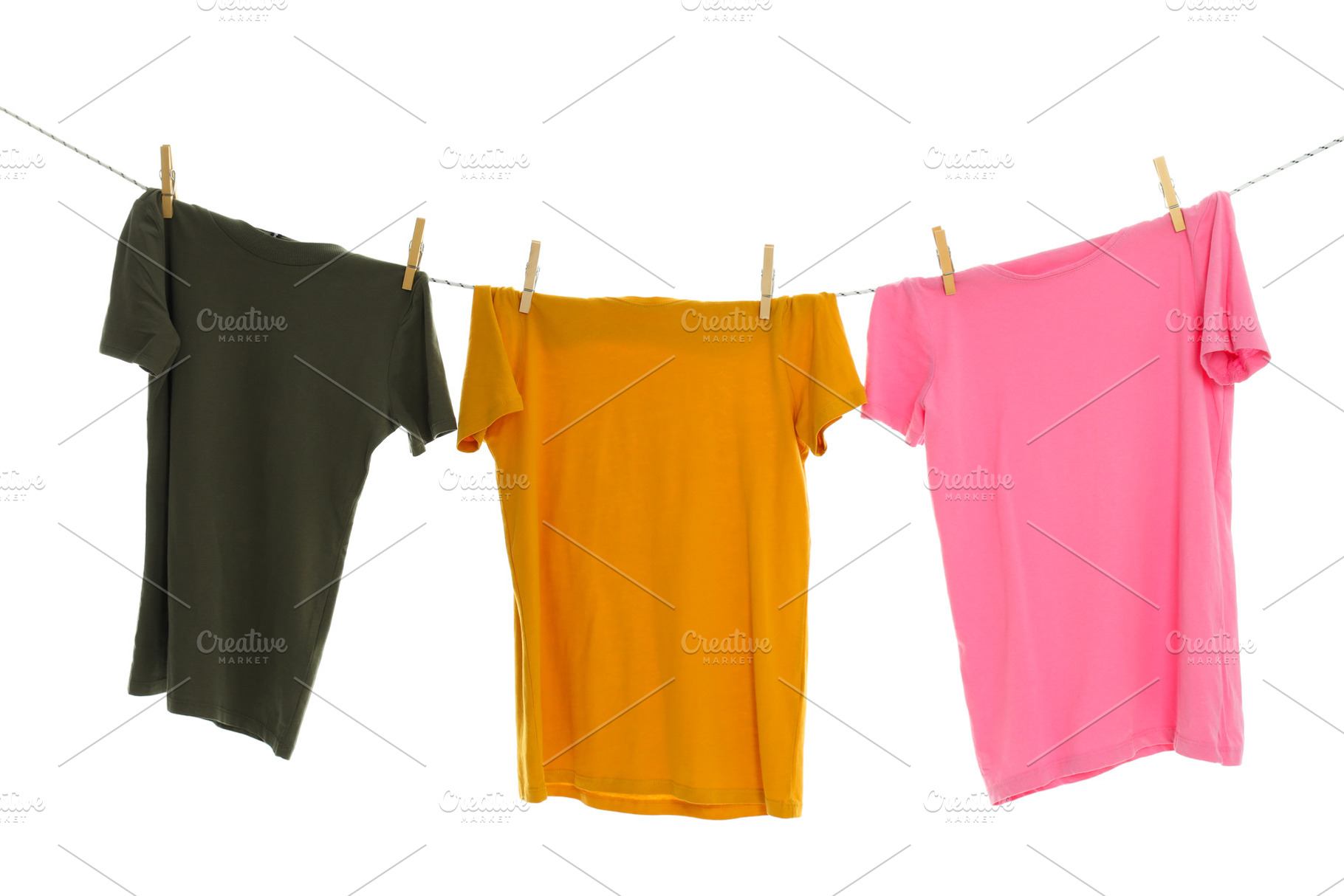 T-shirts hanging on twine, isolated on white background, a Beauty & Fashion Photo by AtlasStudio PRO