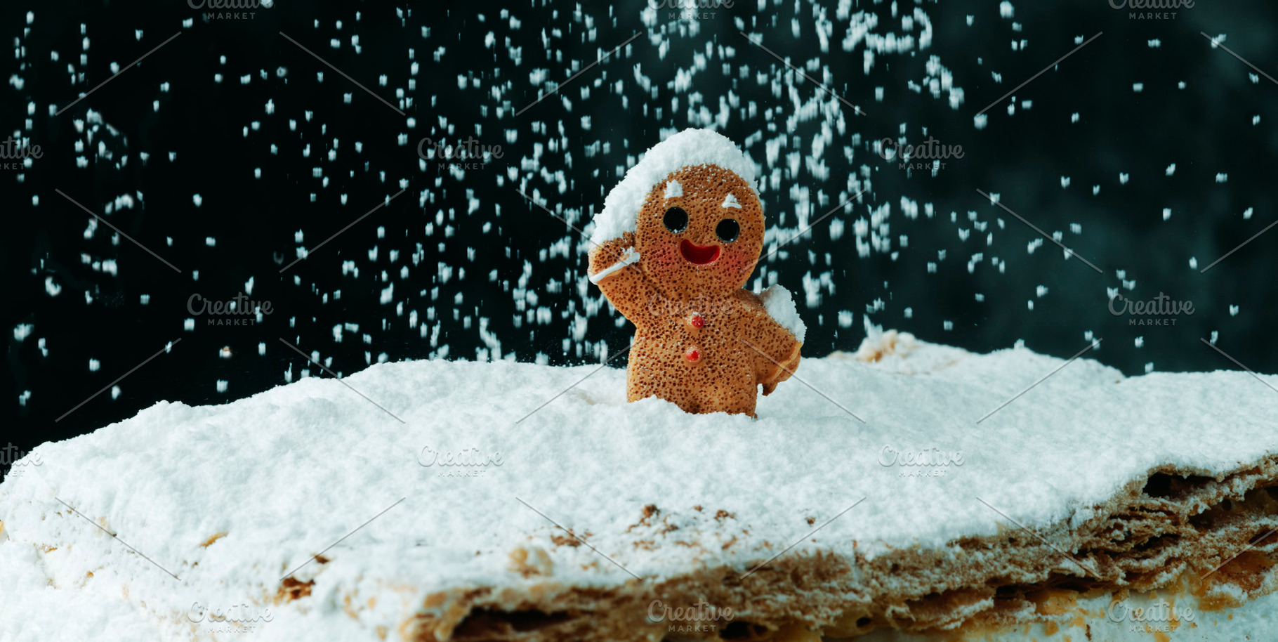 gingerbread man greeting falling snow, banner, a Photo by Nito