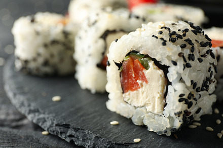 Tray with delicious sushi rolls, close up. Japanese food, a Food & Drink Photo by AtlasStudio