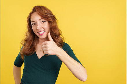 Happy redheaded woman gesturing, a Person Photo by Iván Moreno STOCK PHOTO