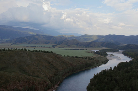 Majestic river Katun in valley of Altai under dramatic sky, a Nature Photo by TravelFlow