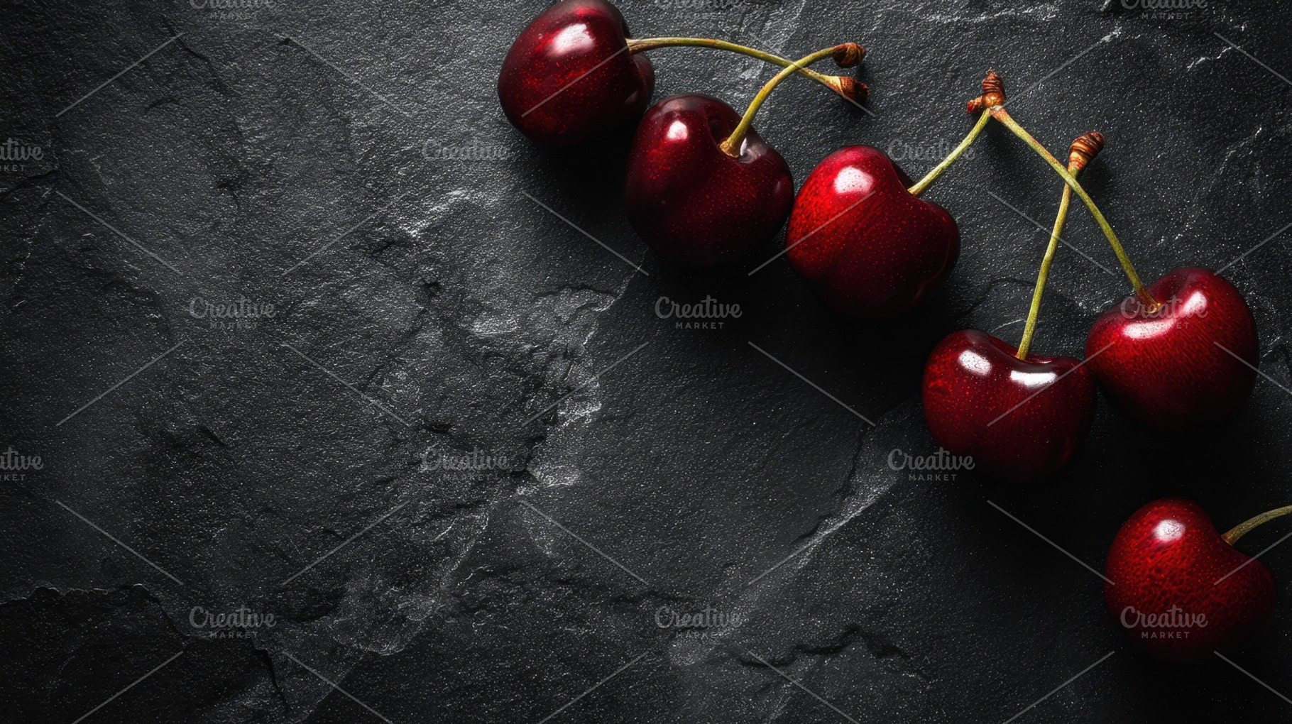 Cherries on dark stone surface, a Photo by Beautiful things
