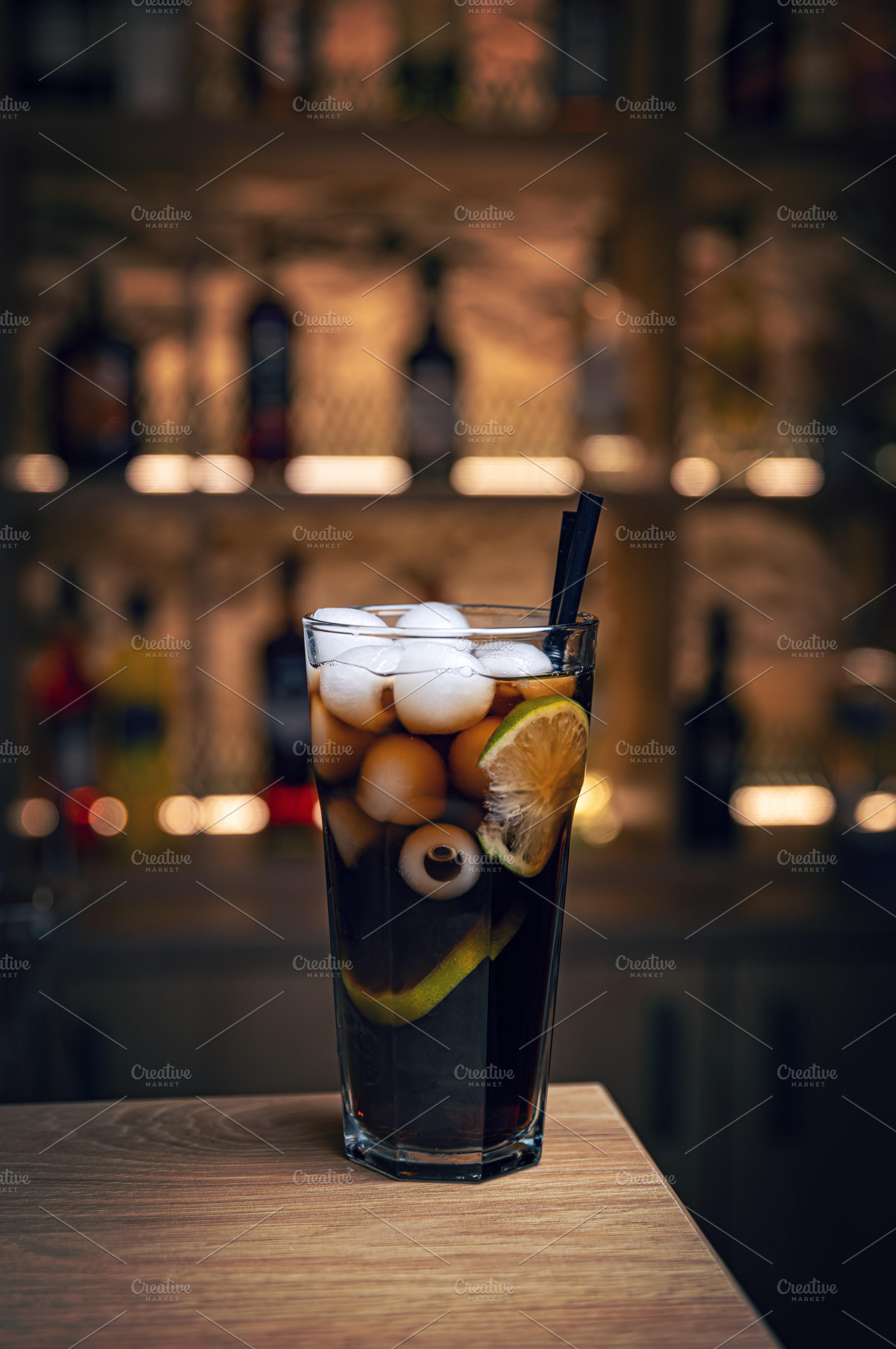 Refreshing halloween cocktail featuring a spooky eyeball and ice, a Photo by Grafvision photography