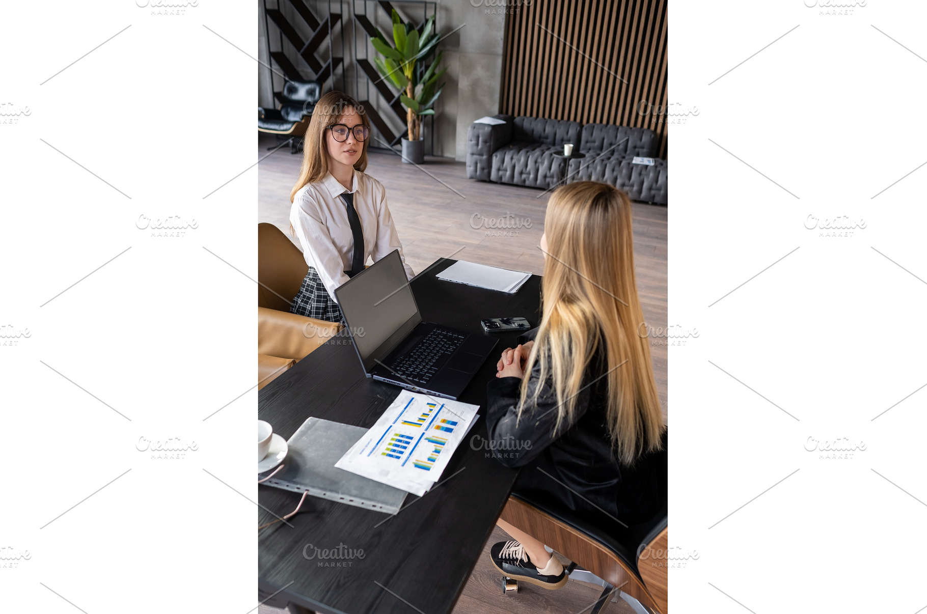 Young woman in formal wear sitting, a School & Education Photo by undrey