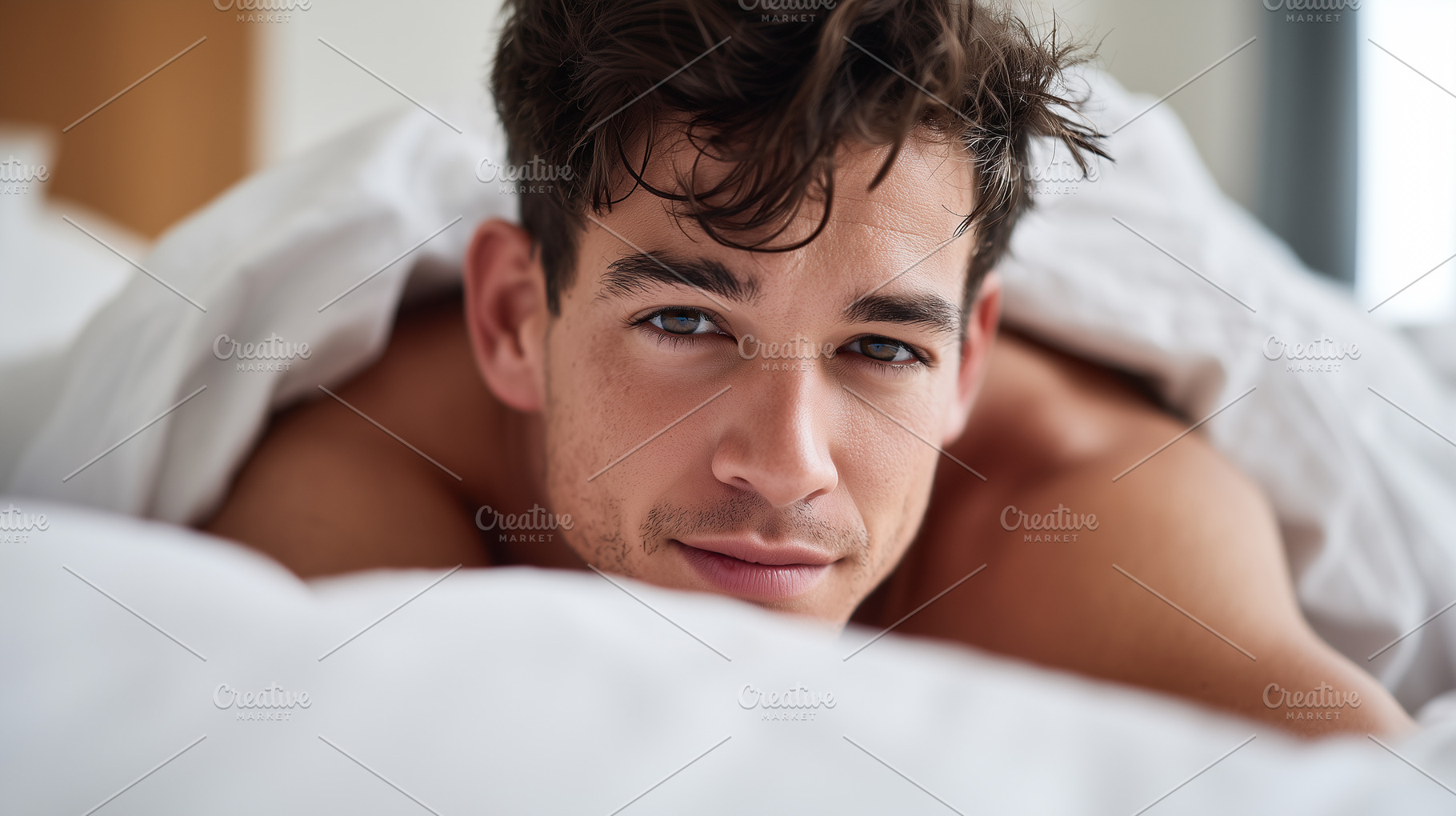 Young man with tousled hair, lying, a Person Photo by MistyDay
