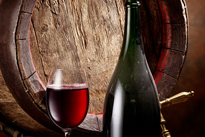 Glass of red wine, wine wooden cask, a Food & Drink Photo by Volff