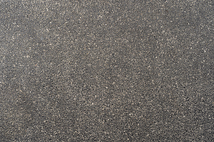 Granite gravel stones flooring pattern surface texture. Close-up, a Background Photo by Tampatra