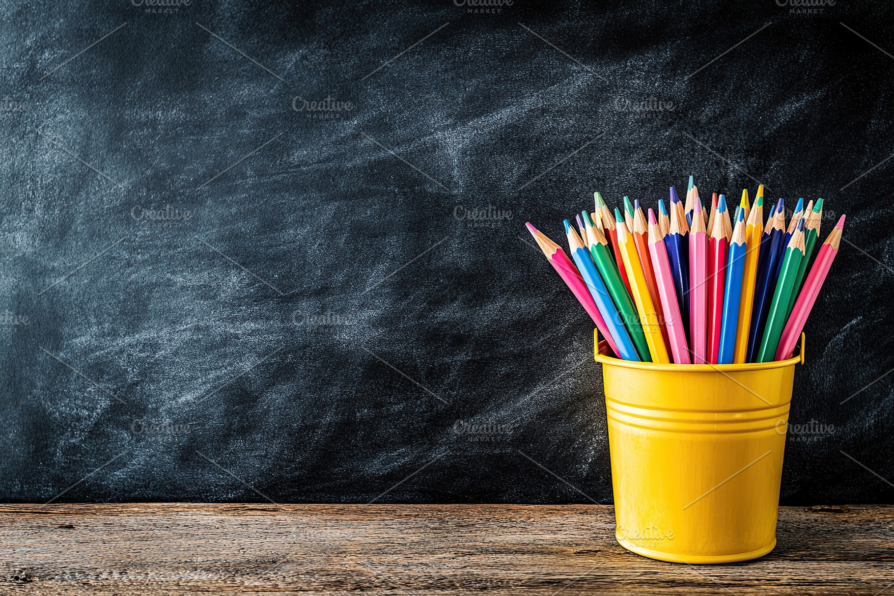 Wooden colorful rainbow pencils in bucket on wooden table, a School & Education Photo by AlyaAnd