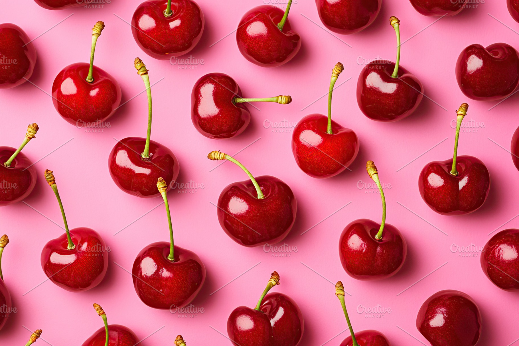 Vibrant red cherries arranged on a pink background for a colorful display, a Food & Drink Photo by AlyaAnd