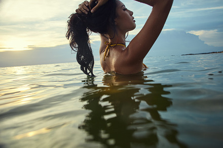 Female model in bikini going to the containing woman, sea, and summer