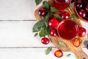 Sweet and tasty red cherry plum juice, a Food & Drink Photo by Rimma