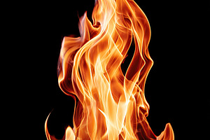 Dynamic flame dancing against a black background in dramatic display of fire's, an Arts & Entertainment Photo by AlyaAnd