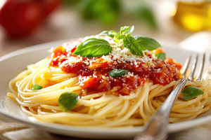 Delicious spaghetti with tomato sauce and basil, a Food & Drink Photo by AlyaAnd