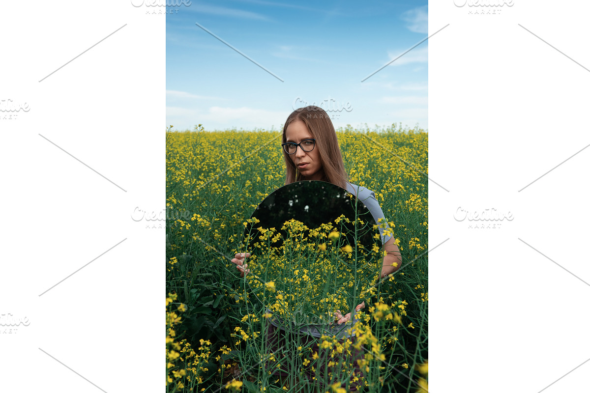 Woman with Mirror in Flower Field, a Graphic by Jan Jack Russo Media