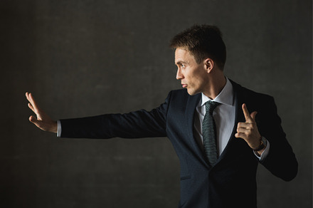 Young businessmen in black suit emotional posing containing businessman
