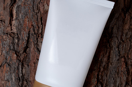empty white tube of cream