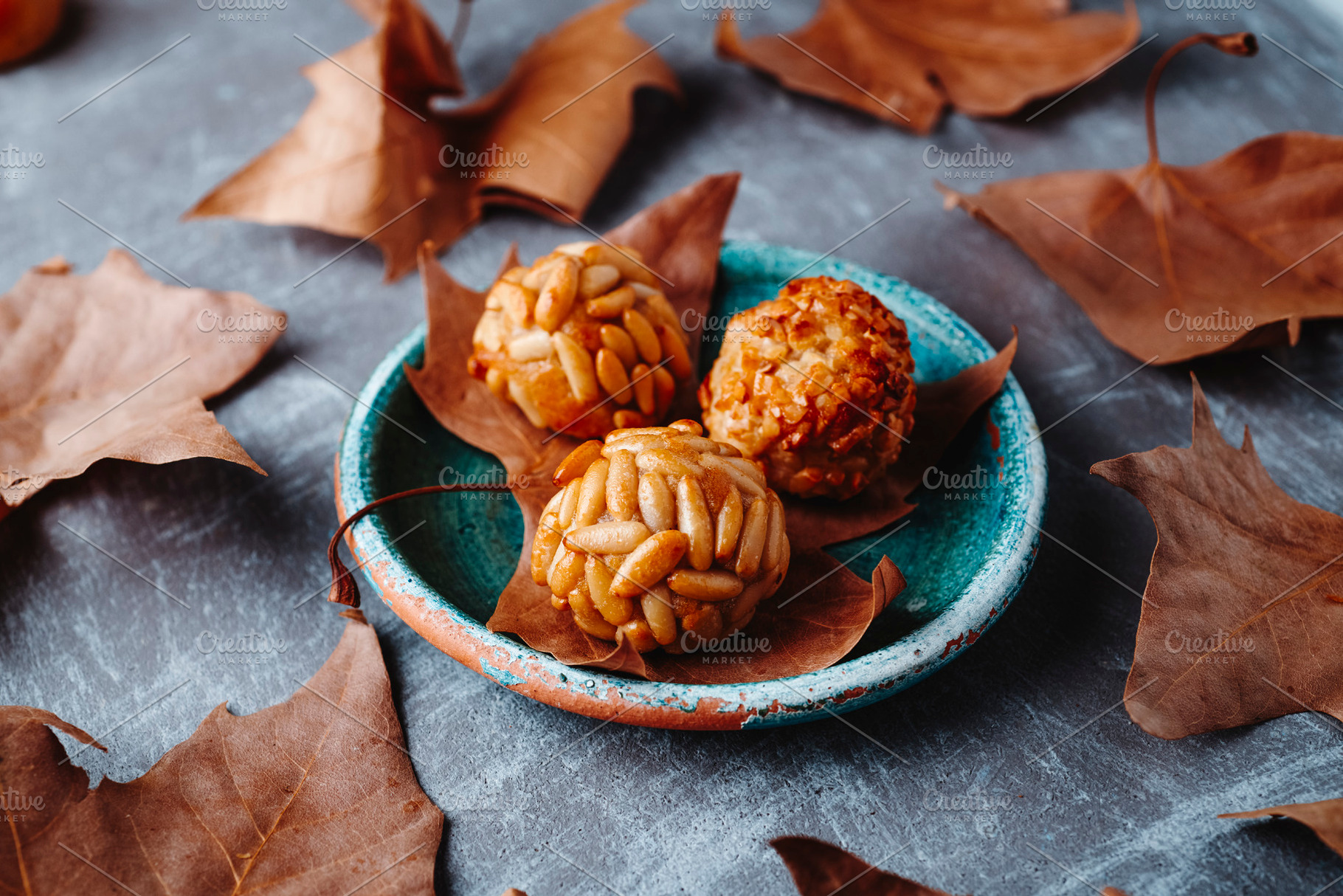 Catalan panellets on a rustic ceramic plate, a Photo by Nito