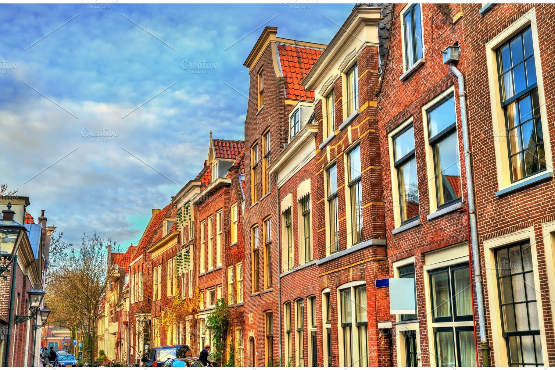 Traditional dutch houses on a street, an Architecture Photo by Leonid Andronov