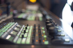 Professional video production switcher console with glowing gree, a Photo by Pictures for you!!!!!!!!!