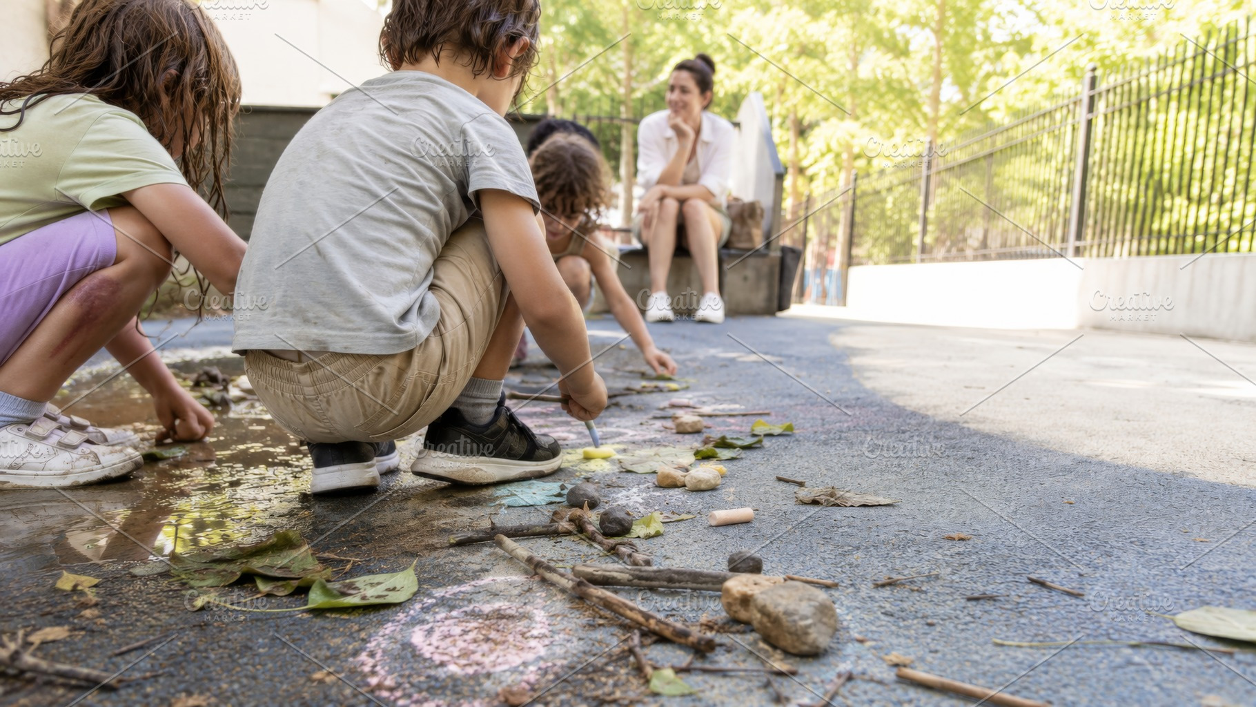 Children playing creatively outdoors, a Photo by Dvoevnore photos
