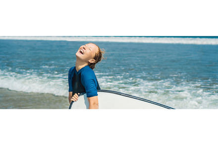 Young woman in swimsuit with surf, a Sports & Recreation Photo by Elizaveta Galitskaya