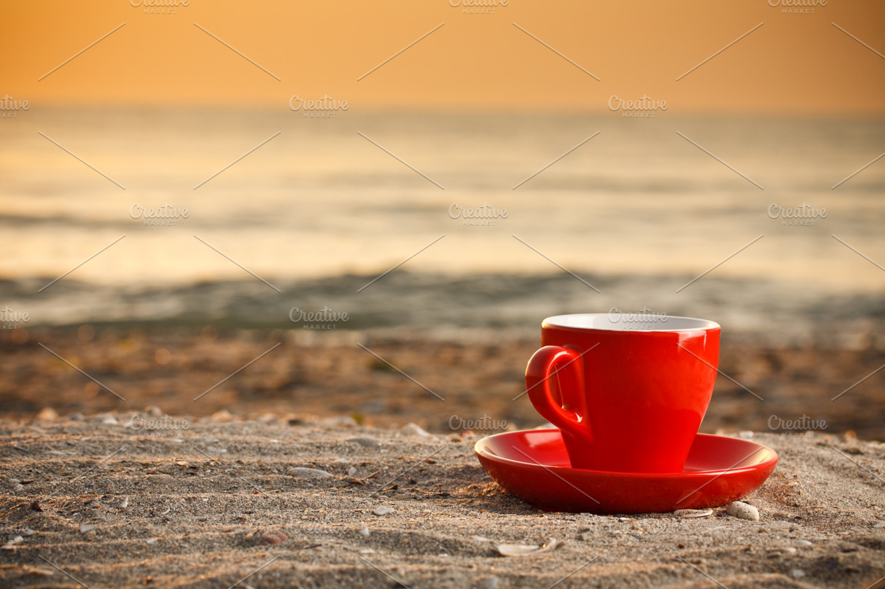 Coffee cup on beach