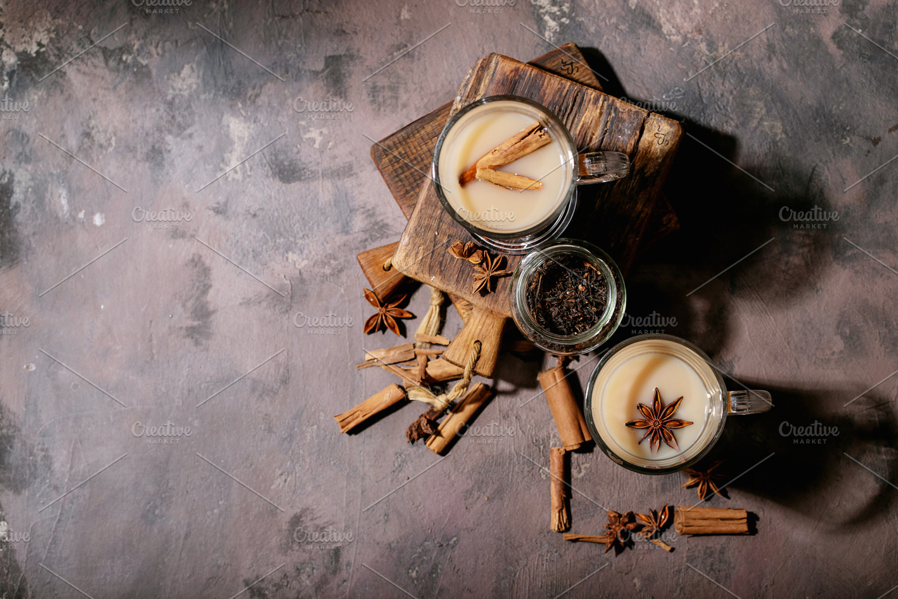 Masala chai served with cinnamon containing chai, drink, and coriander, a Food & Drink Photo by RomanDebree