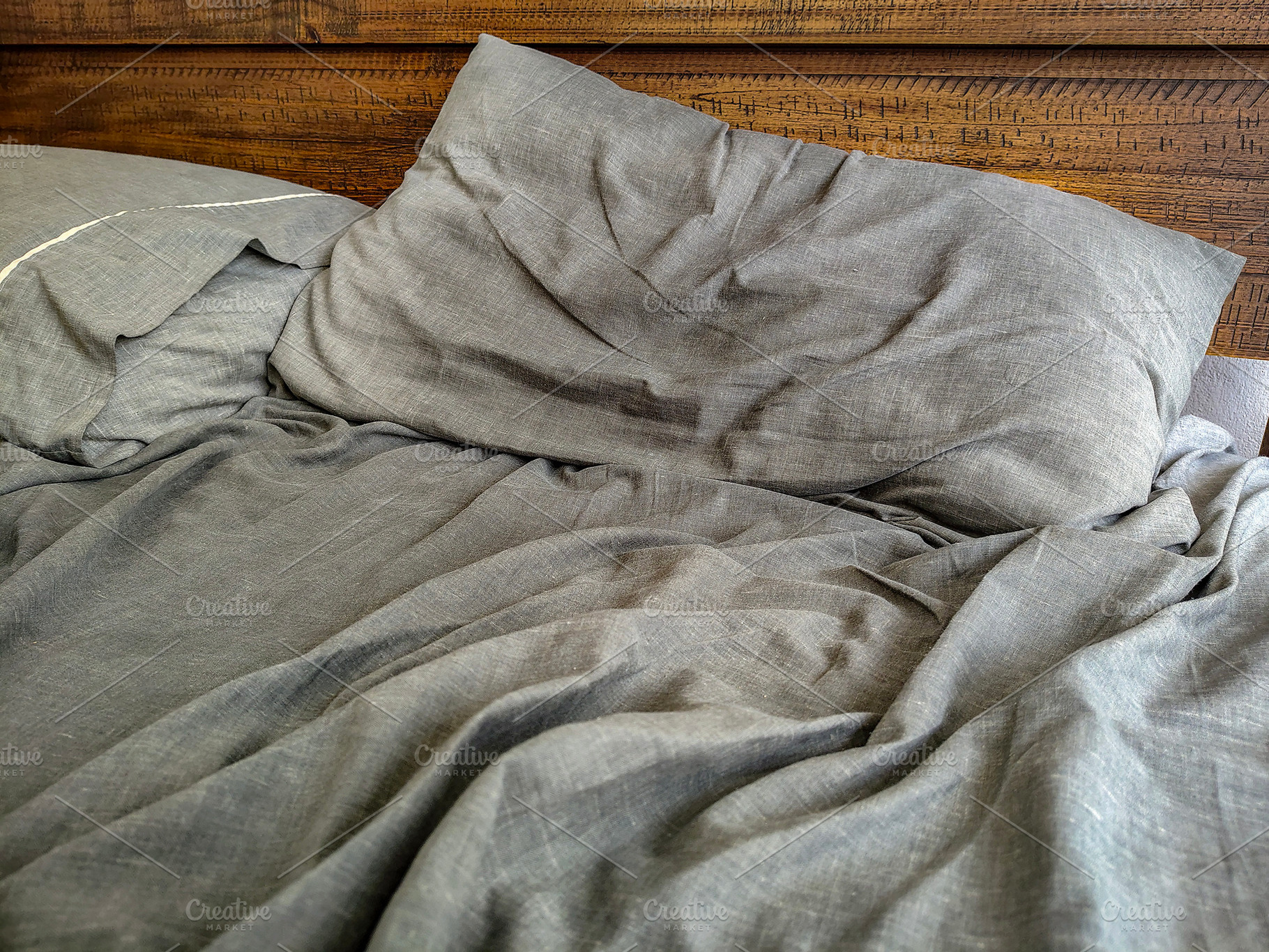 Unnmade bed with pillows and sheets on the mattress, a Beauty & Fashion Photo by DanFLCreativo
