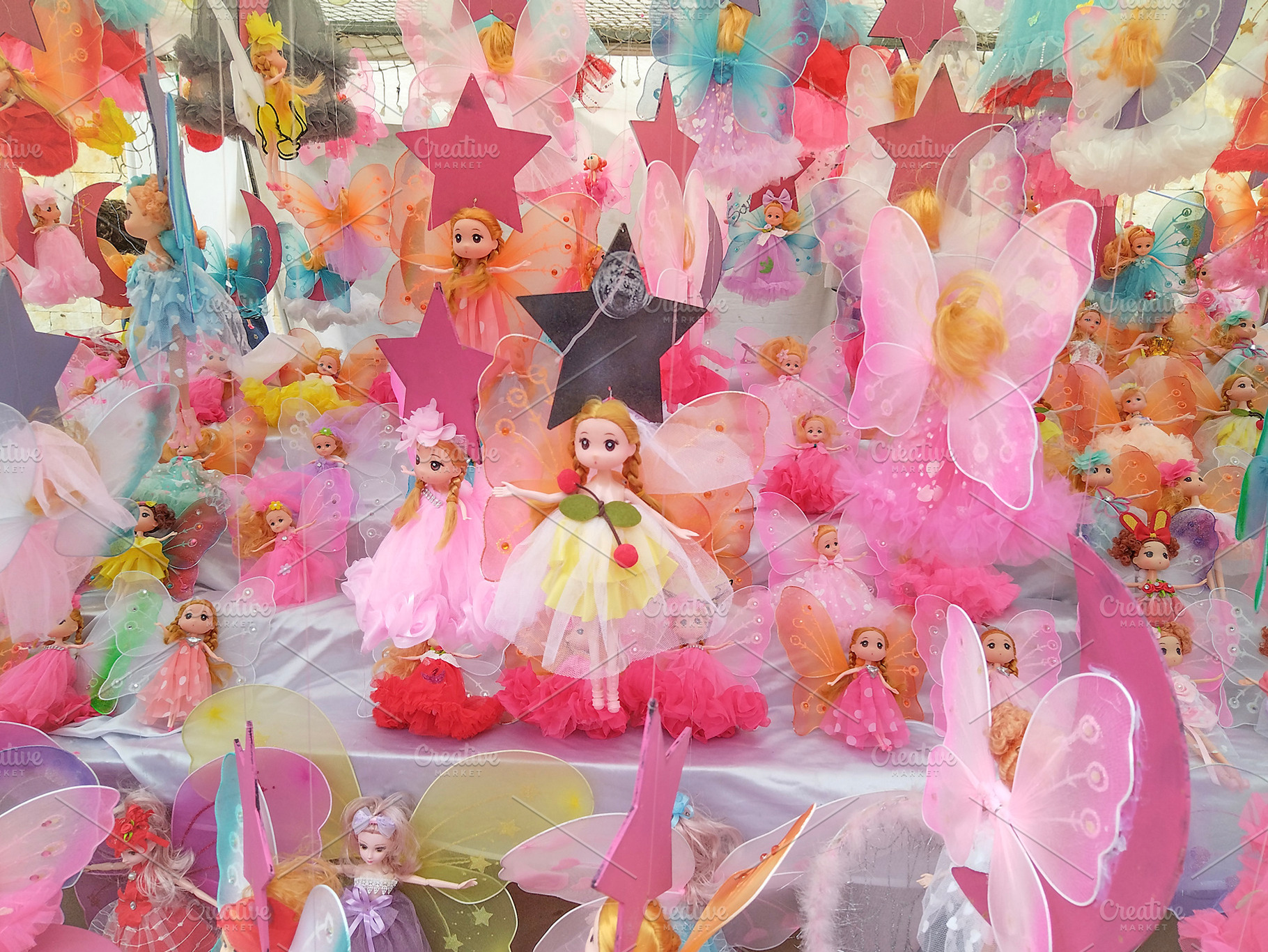 Colorful display of fantasy dolls at market, an Arts & Entertainment Photo by DanFLCreativo