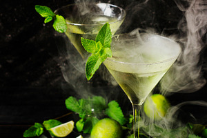 Martini or mint liqueur with lime selective focus featuring background, mint