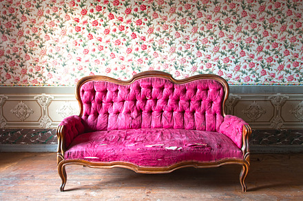 Old damaged pink couch