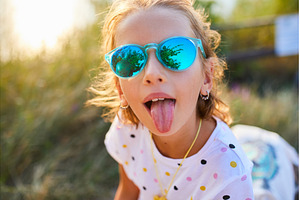 Young girl enjoys sunny day outdoors, a Nature Photo by IlliaBondarPhotography