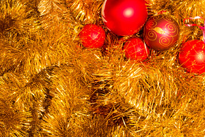 Gold tinsel and red christmas balls. Christmas decoration.