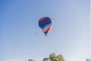 Hot air balloon floating in the, a Holiday Photo by Elizaveta Galitskaya