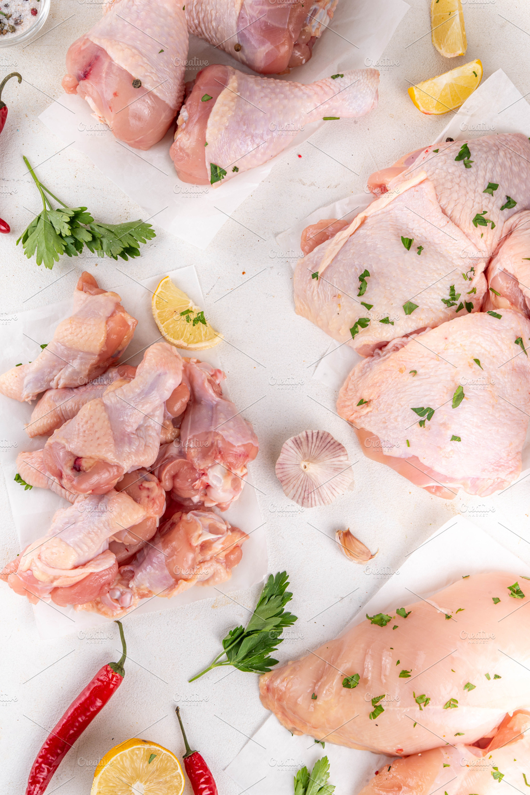 Different chicken meat, with spices, condiments, sauces, marinad, a Food & Drink Photo by Rimma