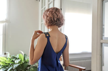 young beautiful lady wearing a blue dress posing in the living room, a Person Photo by 2Design