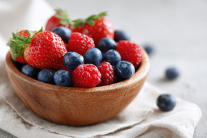 Fresh and ripe summer fruits in brown bowl, a Food & Drink Photo by AlyaAnd