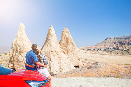 Family on car vacation. Happy couple travel by car in mountains., a Person Photo by travnikovstudio