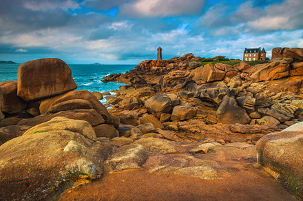 Lighthouse and granite rocks, France, a Nature Photo by Alpine Dreams