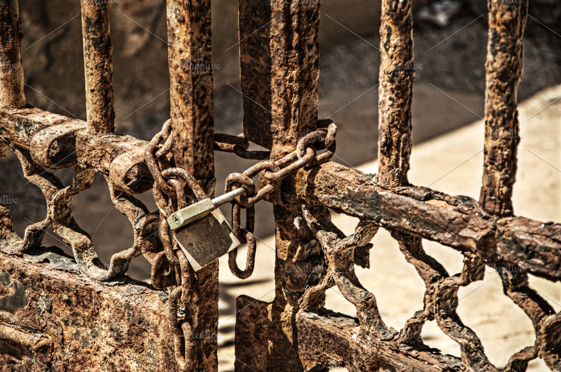 Iron gate with padlocks, an Architecture Photo by lsalas-morera