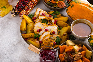 Thanksgiving day dinner with turkey, a Food & Drink Photo by Yulia Furman