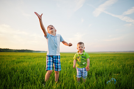 Two brothers in green grass field., a Person Photo by AS photostudio
